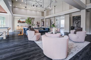 New Orleans apartment for rent - A living room with a black floor and white walls.