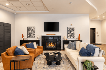 Seattle apartment for rent - A living room with a fireplace and a television on the wall.