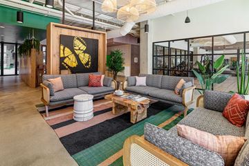 Columbus apartment for rent - A modern living room with a grey sofa and a wooden coffee table.