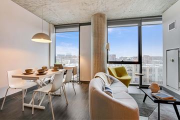 Chicago apartment for rent - A modern living room with a dining table and chairs.