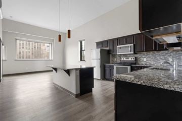 Bridgeport apartment for rent - A kitchen with a granite counter top and a window.