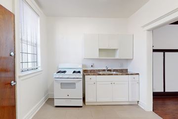 Chicago apartment for rent - A kitchen with a stove and sink.