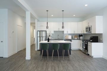 Chicago apartment for rent - A modern kitchen with a dining table and chairs.