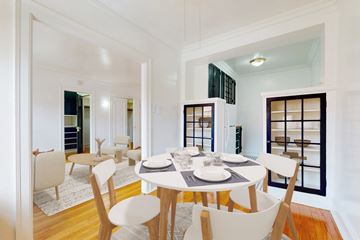 Chicago apartment for rent - A dining room with a white table and chairs.