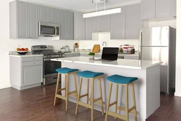 Chicago apartment for rent - A kitchen with a white counter and blue stools.