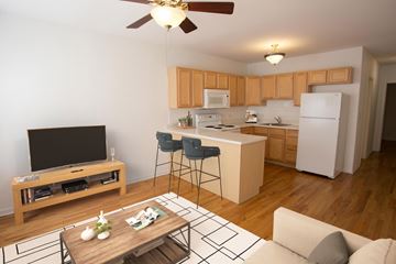 Chicago apartment for rent - A modern kitchen with wooden cabinets and a white refrigerator.