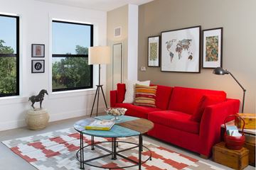 Chicago apartment for rent - A living room with a red couch and a coffee table.