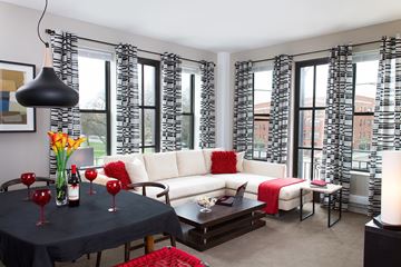 Chicago apartment for rent - A living room with a black table and white couch.