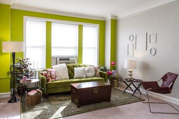 Chicago apartment for rent - A living room with a green couch and a brown coffee table.