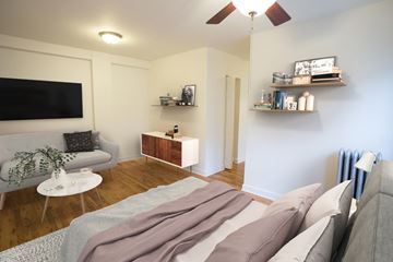 Chicago apartment for rent - A living room with a grey couch and a white coffee table.
