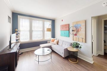 Kansas City apartment for rent - A living room with a white couch and a coffee table.