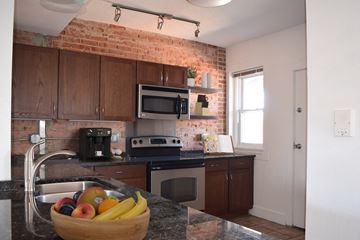 Kansas City apartment for rent - A kitchen with a bowl of fruit on the counter.