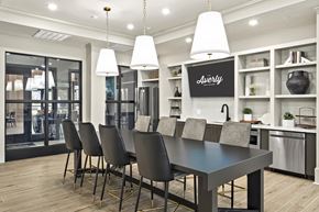 Alpharetta apartment for rent - A modern kitchen with a dining table and chairs.