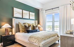 West Palm apartment for rent - a bedroom with a bed and a large window