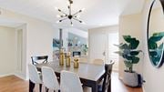 Dunwoody apartment for rent - a dining room with a table and chairs and a chandelier