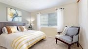 Dunwoody apartment for rent - a bedroom with a bed and a chair