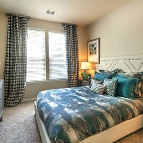 Estero apartment for rent - a bedroom with a bed and two windows