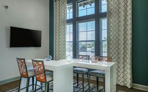 Estero apartment for rent - a seating area with a table and chairs in front of a window