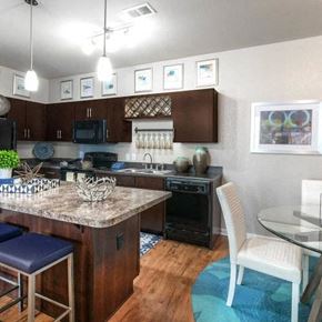 Estero apartment for rent - a kitchen and dining room with a table and chairs