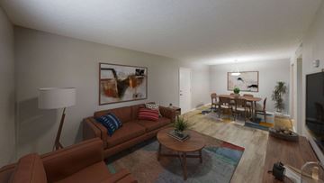 Louisville apartment for rent - A living room with a brown couch and a coffee table.