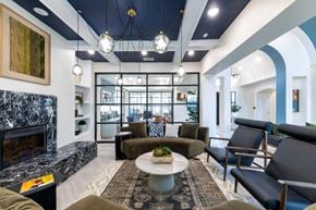 Corinth apartment for rent - A modern living room with a fireplace and comfortable seating.