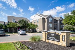 Carrollton apartment for rent - A sign that says Fountains at Rosemead in front of a building.