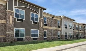 Abilene apartment for rent - A row of apartment buildings with stone and siding exteriors.