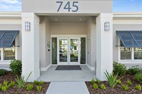 Tarpon Springs apartment for rent - The image shows the front of a building with the number 745 on it.