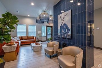 Austin apartment for rent - A living room with a large painting of a rabbit on the wall.