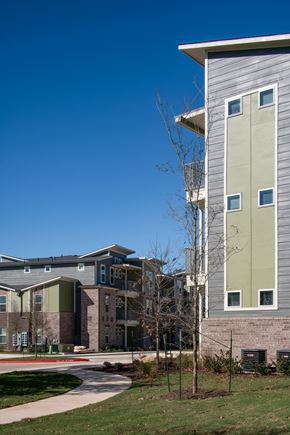 Georgetown apartment for rent - A modern building with a grey and green facade.