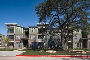 Georgetown apartment for rent - Apartment complex with a tree in front.