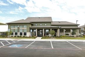Abilene apartment for rent - A building with a parking lot in front of it.