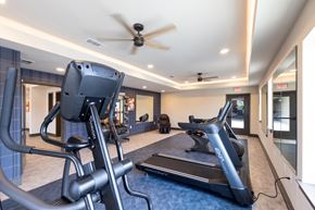 Grand Prairie apartment for rent - A gym with a treadmill and a stationary bike.