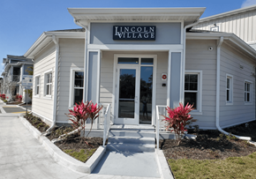 Bradenton apartment for rent - The front of a building with the words "Lincoln Village" on it.