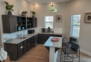 Bradenton apartment for rent - A kitchen with a table and chairs in the middle.