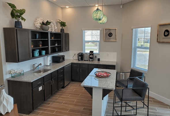 Bradenton apartment for rent - A kitchen with a table and chairs in the middle.