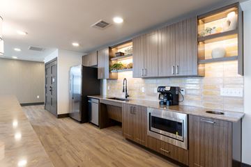 Arlington apartment for rent - A modern kitchen with wooden cabinets and stainless steel appliances.