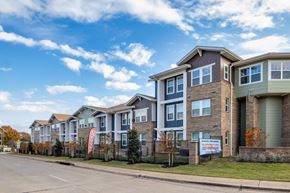 Arlington apartment for rent - A row of houses with a sign in front of them.