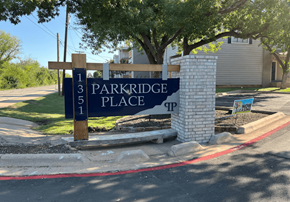 Abilene apartment for rent - A sign for Parkridge Place is displayed in front of a building.