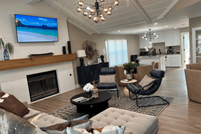 Abilene apartment for rent - A modern living room with a fireplace and a flat screen TV mounted on the wall.