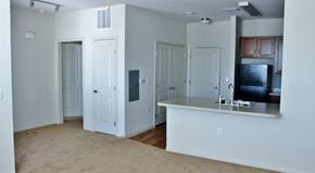 Abilene apartment for rent - A white kitchen with a counter and cabinets.