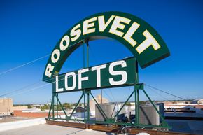 San Angelo apartment for rent - A large green sign with the words "Roosevelt Lofts" on it.