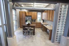 Tyler apartment for rent - A kitchen with a table and chairs in the middle of the room.