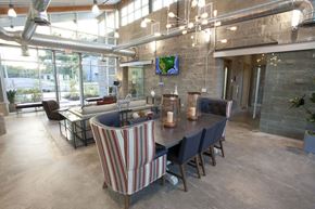 Tyler apartment for rent - A modern dining room with a long table and striped chairs.