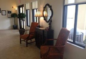 Lake Wales apartment for rent - Two chairs are in front of a desk with a lamp on it.