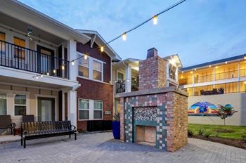 Outdoor gathering spaces with a courtyard and fireplace