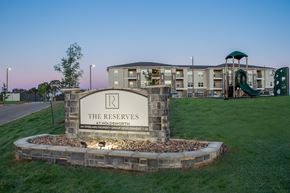 Kerrville apartment for rent - A sign for The Reserves at Holdsworth by Inverness Property Group Development.