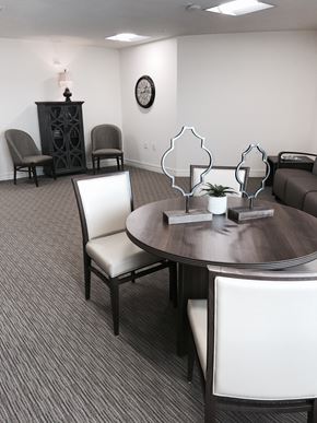 Punta Gorda apartment for rent - A conference room with a table, chairs, and a clock on the wall.