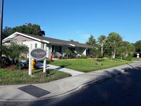 Tarpon Springs apartment for rent - A sign for Villages at Peterson Park is on the corner of a street.