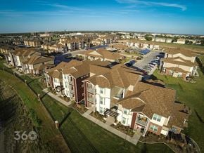 Abilene apartment for rent - A bird's eye view of a residential area with houses and a parking lot.